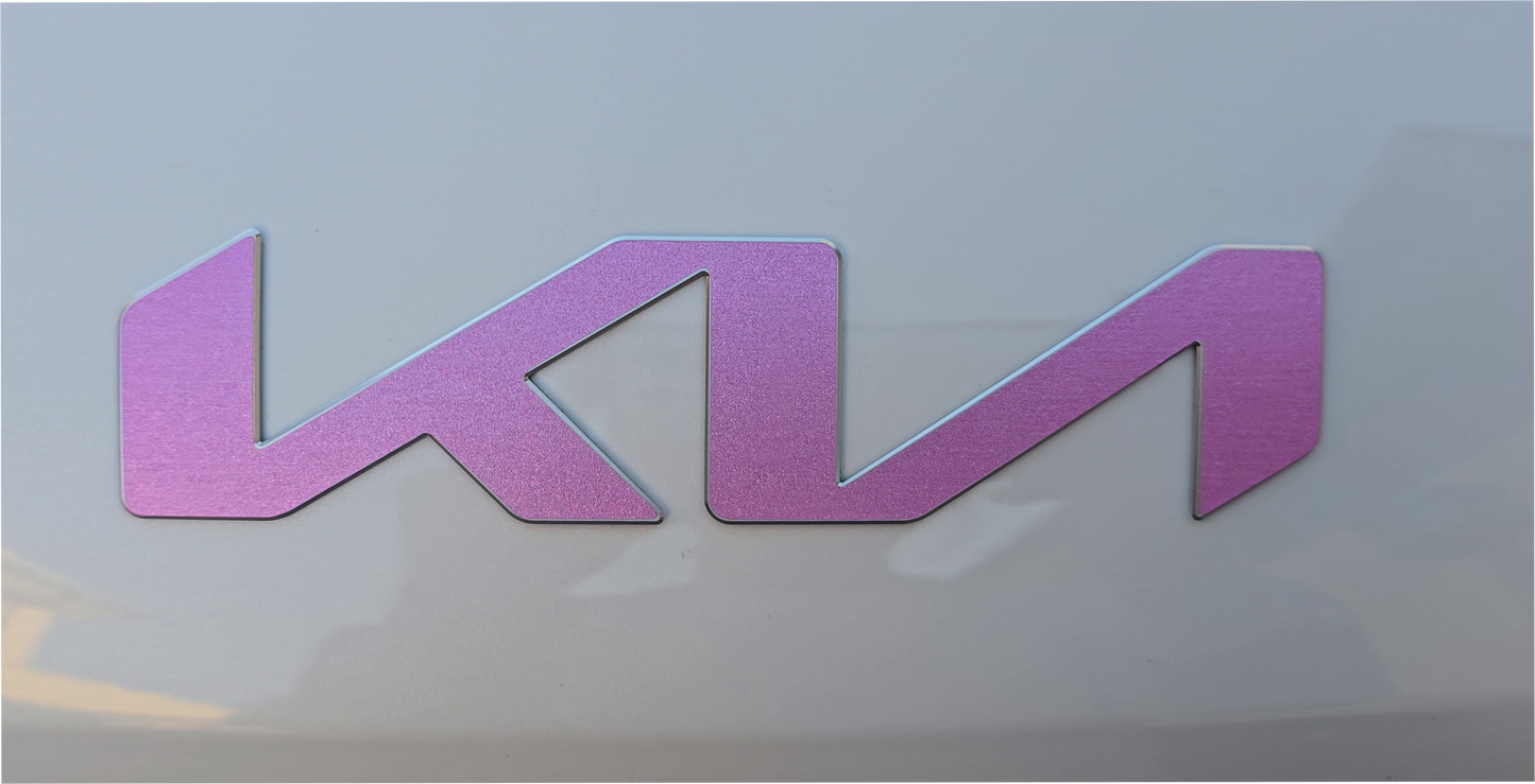 Pink Carnation Kia emblem overlay on a white car