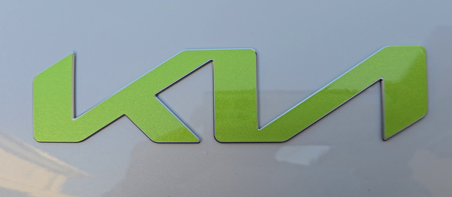 Green KIA emblem overlay on a white background